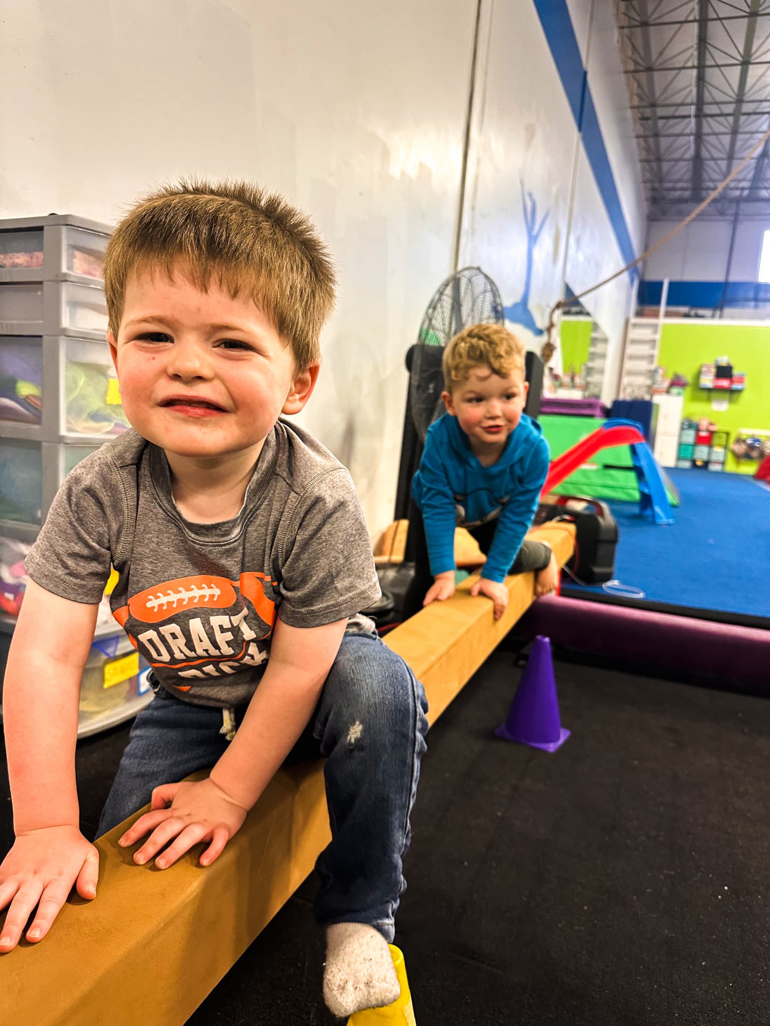 Toddlers exploring the balance beam at Gym Stars