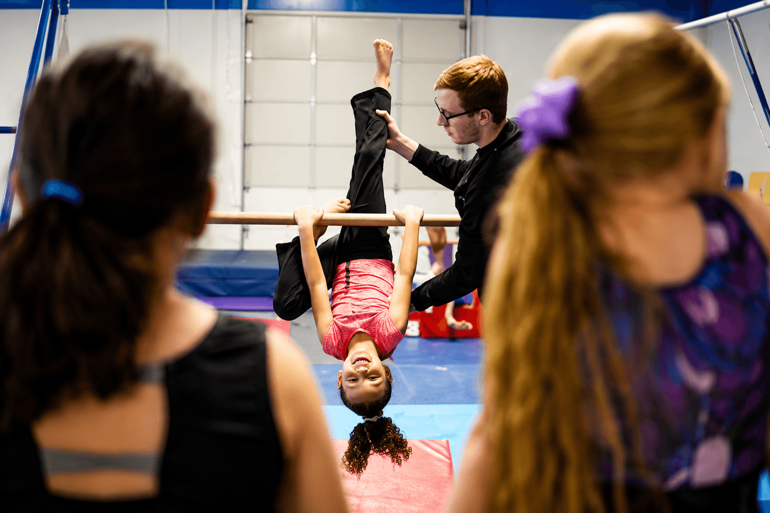 Recreational gymnasts walking the beam together